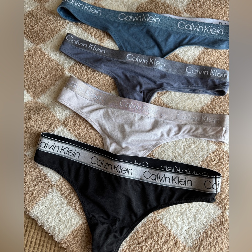 LOT of four (4) Calvin Klein bikini thongs NWOT panties underwear